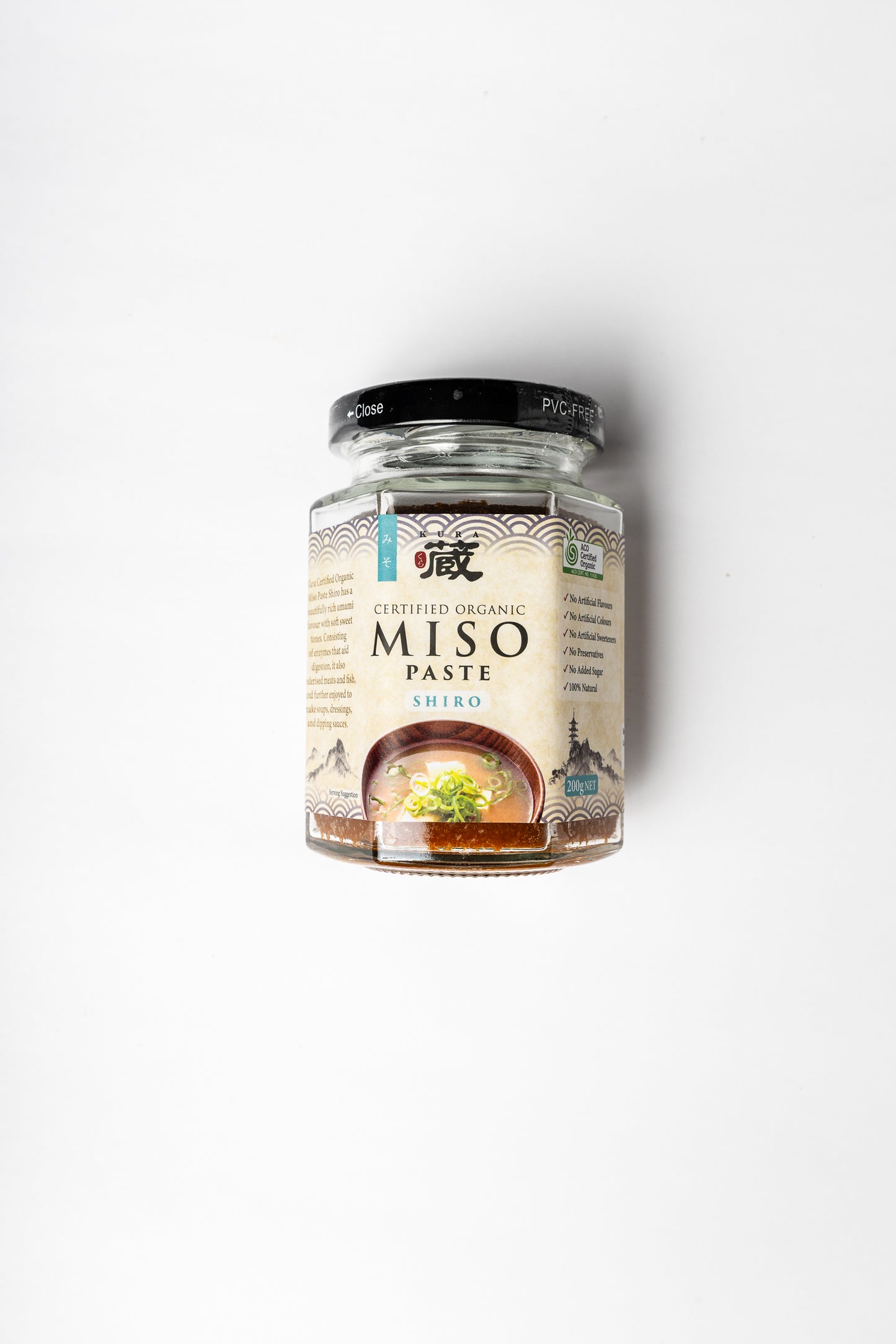 A glass jar of Shiro Miso Paste with a black lid and a cream-colored label, centered on a plain white background.